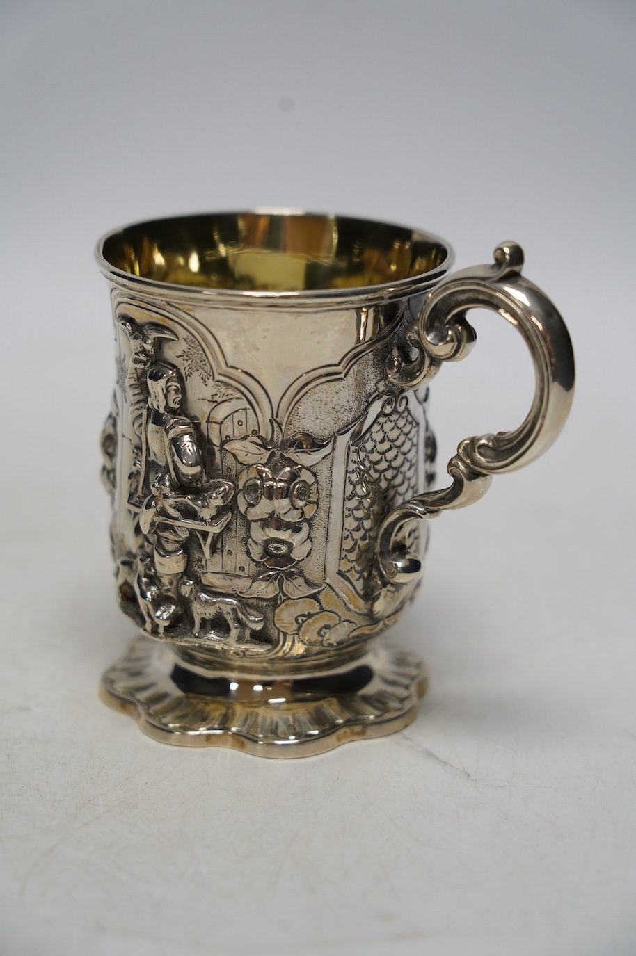 A Victorian silver christening mug, embossed with a gentleman with birds and dogs, James Charles Edington, London, 1853, 10.5cm, 6.6oz. Condition - fair to good